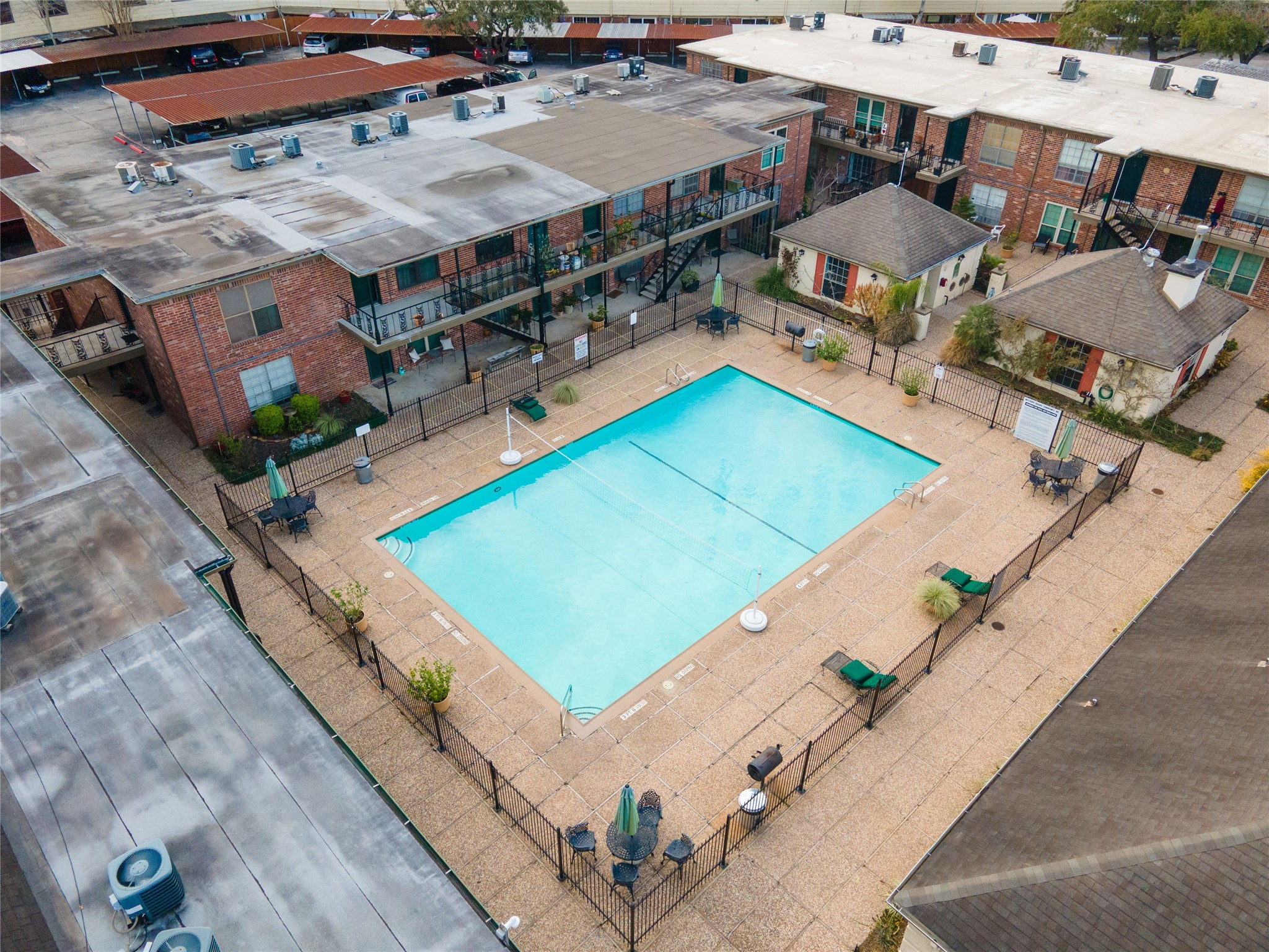 11540 Chimney Rock Road, Unit 117 Houston, TX 77035 - Photo 36 of 38 an aerial view of a tennis ground with large trees