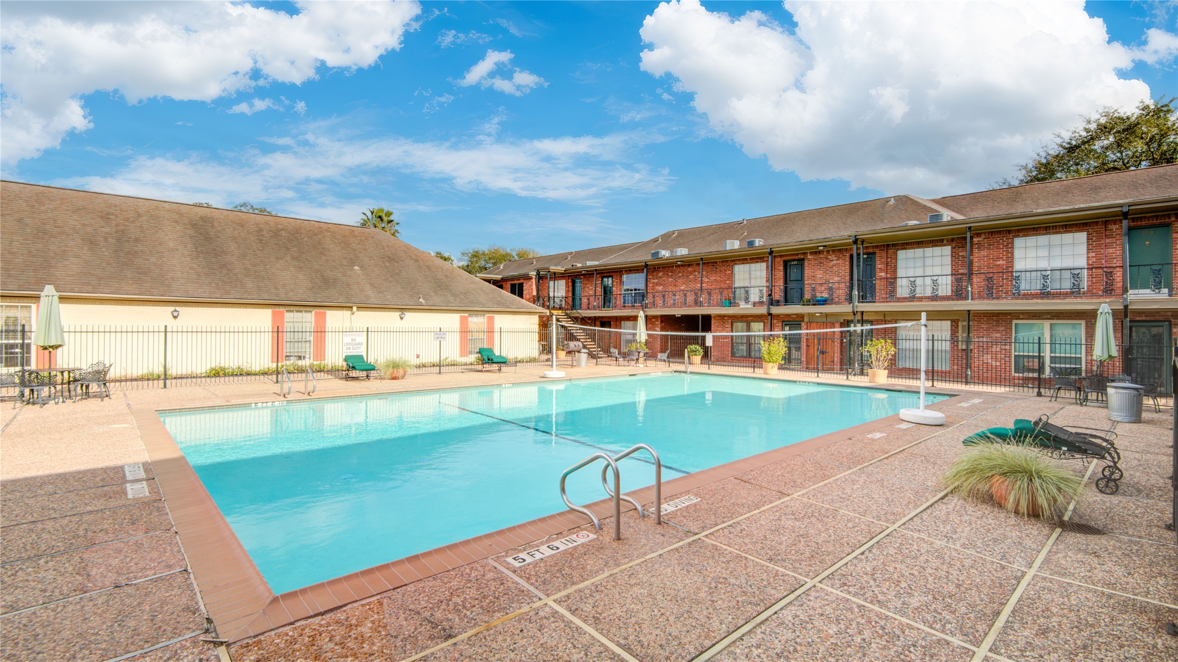 11540 Chimney Rock Road, Unit 117 Houston, TX 77035 - Photo 9 of 38 a view of a patio with swimming pool table and chairs