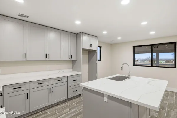 a white toilet sitting next to a bathroom sink