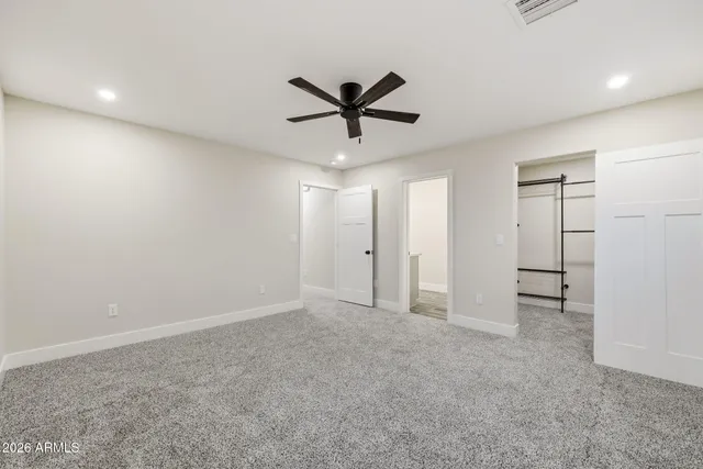 a bathroom with a sink toilet double vanity and shower