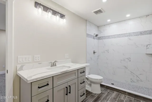 an empty room with a ceiling fan and window