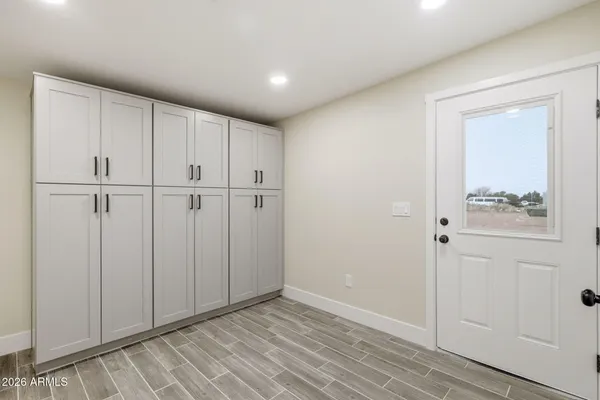 a view of a kitchen with wooden floor