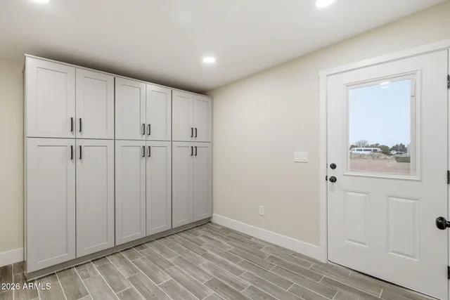 a view of a kitchen with wooden floor