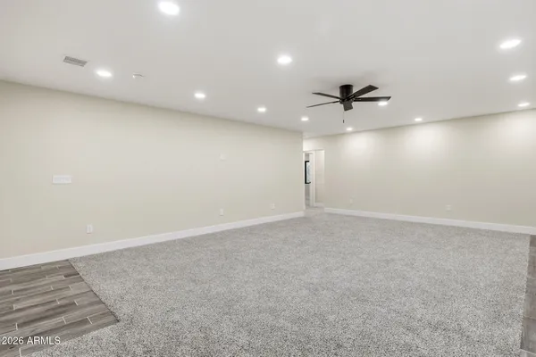 a view of a kitchen with white cabinets