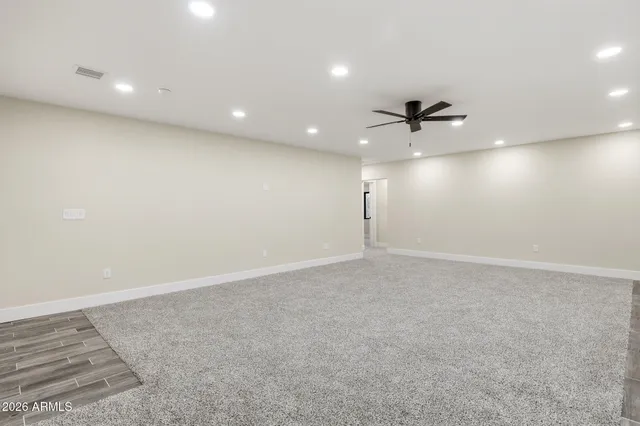a view of a kitchen with white cabinets