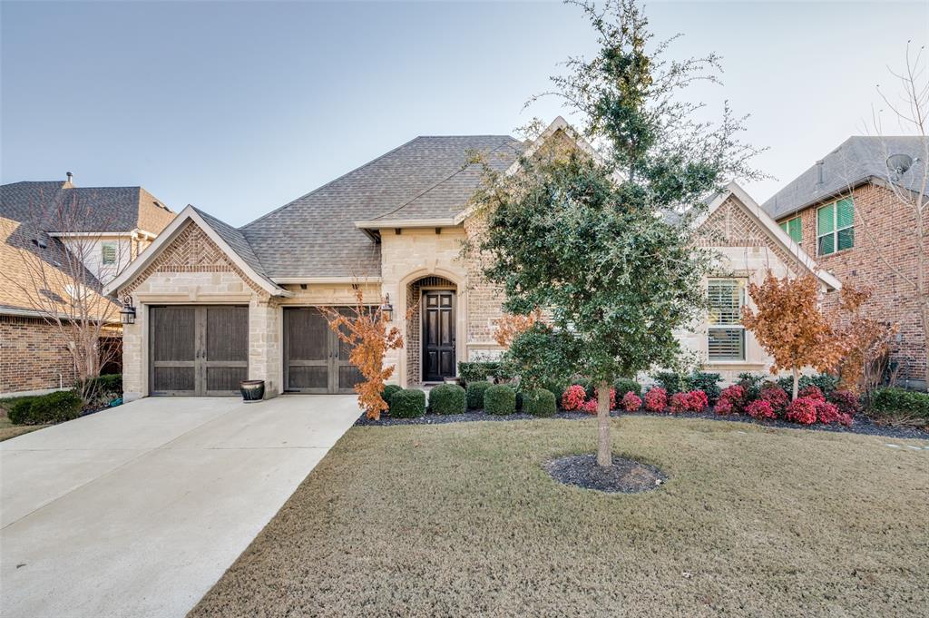 8274 Sylvan Dale Road Frisco, TX 75036 - Photo 1 of 1 a front view of a house with a yard and garage