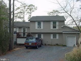 37 Saltgrass Road Ocean Pines, MD 21811 - Photo 1 of 4 a car parked in front of a house