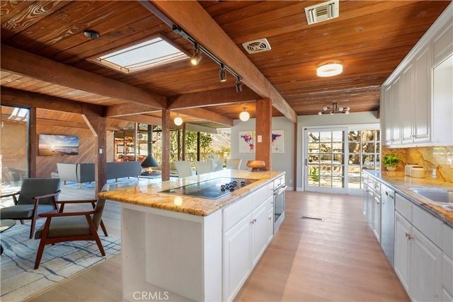 a room with sink and view of living room