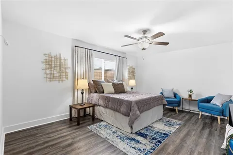 a bed room with a bed and a chair