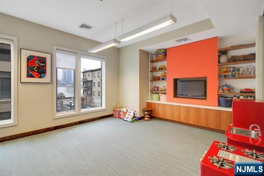 55 Eton Row Weehawken, NJ 07086 - Photo 17 of 28 a room with toys and furniture