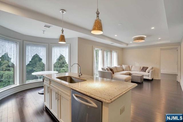 55 Eton Row Weehawken, NJ 07086 - Photo 6 of 28 a living room with furniture and a large window