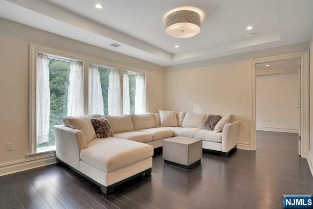 55 Eton Row Weehawken, NJ 07086 - Photo 7 of 28 a living room with furniture and a large window