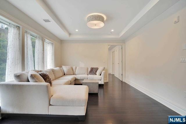 55 Eton Row Weehawken, NJ 07086 - Photo 8 of 28 a living room with furniture and a large window