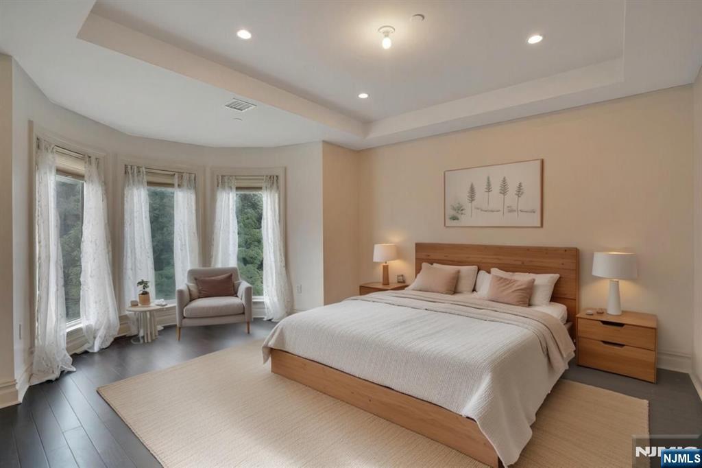 55 Eton Row Weehawken, NJ 07086 - Photo 9 of 28 a bedroom with a bed and wooden floor