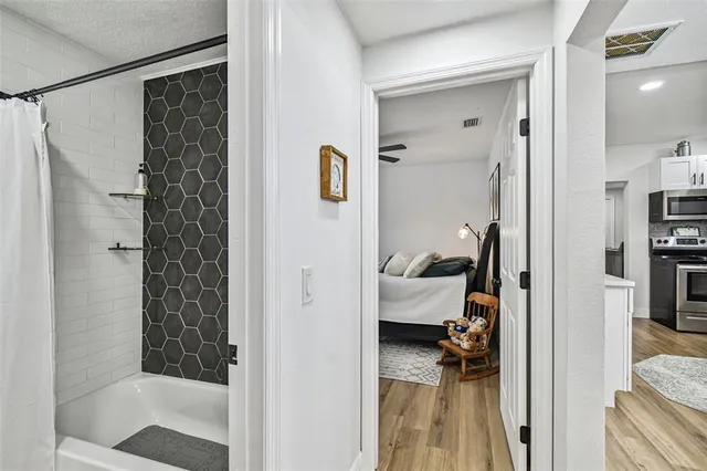 a kitchen with granite countertop a stove and a sink