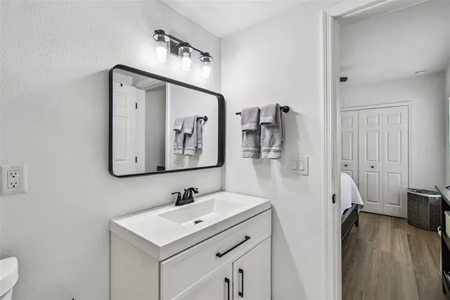 a view of a house with swimming pool and sitting area