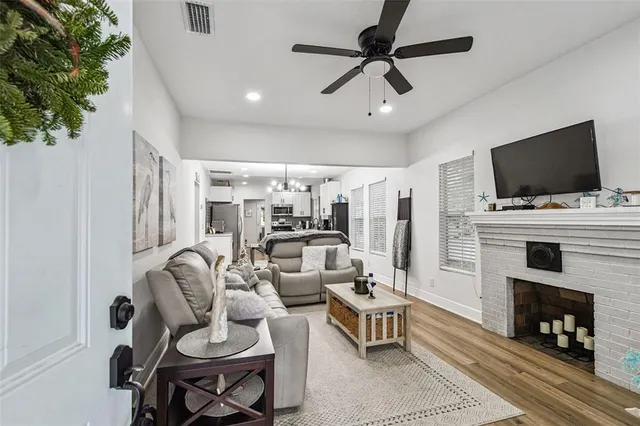 a kitchen with stainless steel appliances a refrigerator sink stove microwave and cabinets