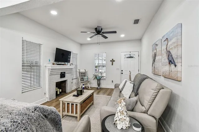 a kitchen with stainless steel appliances a stove sink microwave and cabinets