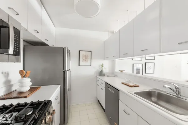 a kitchen that has a sink and a stove