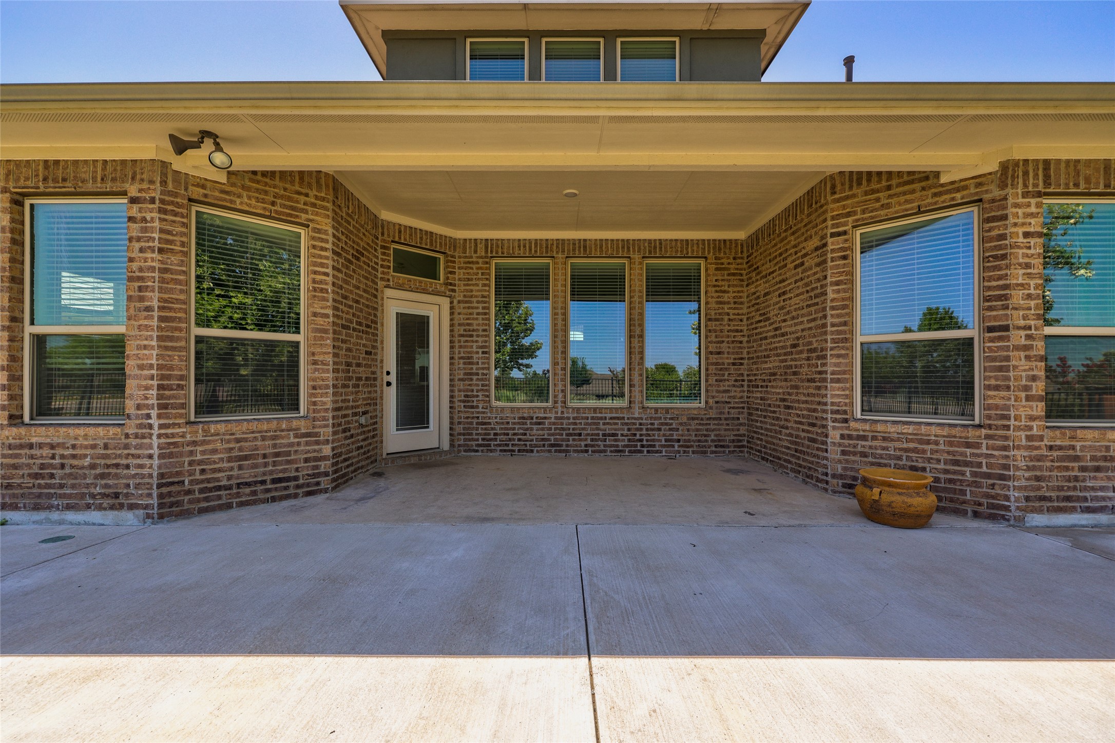 409 Betony Loop Buda, TX 78610 - Photo 28 of 38 A spacious covered patio provides an ideal outdoor living area for relaxation or entertaining.