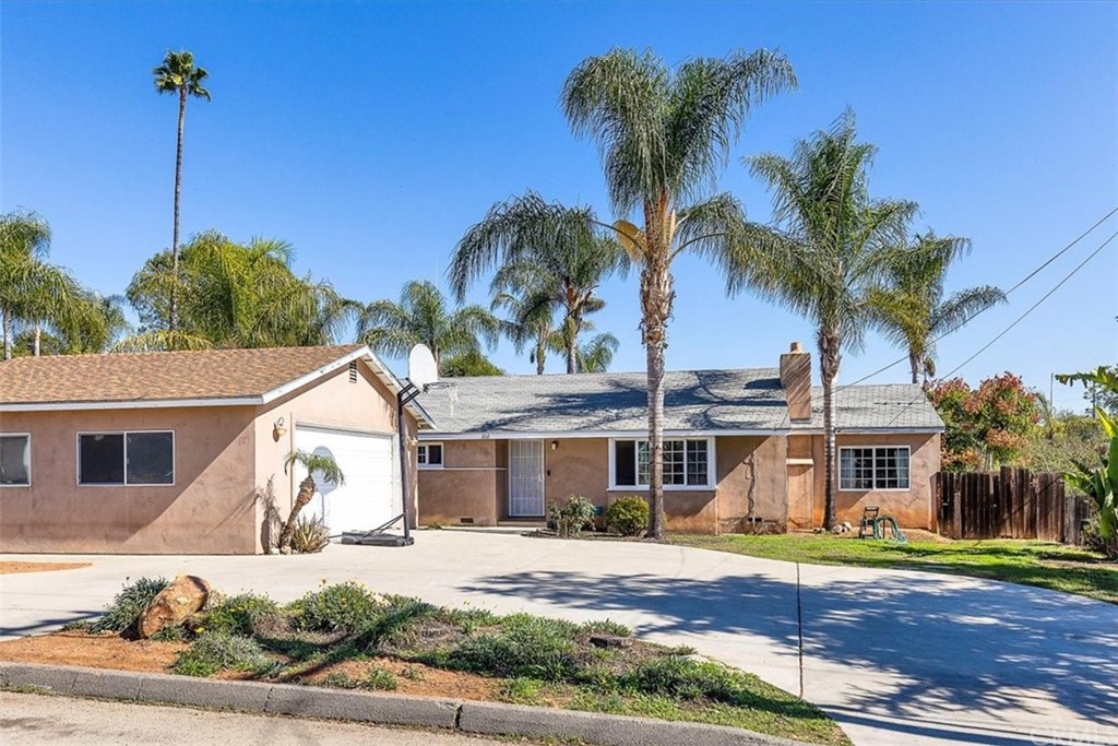 202 Potter Street Fallbrook, CA 92028 - Photo 1 of 1 a front view of a house with a yard and potted plants