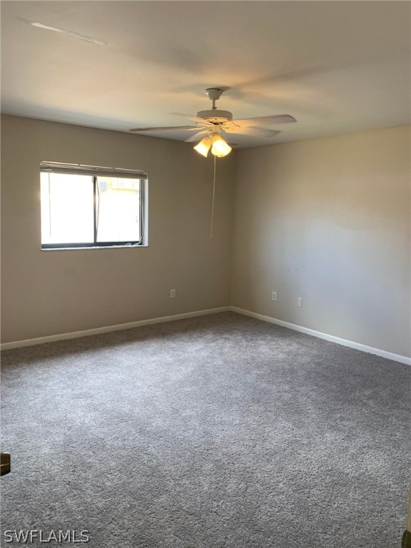 7581 Carrier Road Fort Myers, FL 33967 - Photo 13 of 14 an empty room with a window