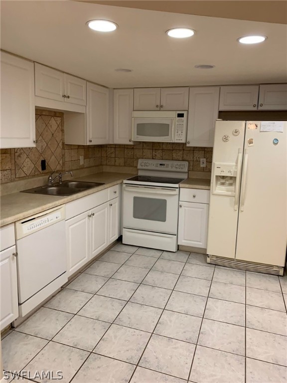 7581 Carrier Road Fort Myers, FL 33967 - Photo 2 of 14 a kitchen with a stove a sink and a refrigerator