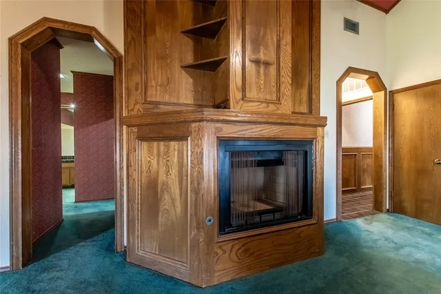 a view of fireplace and window in a room