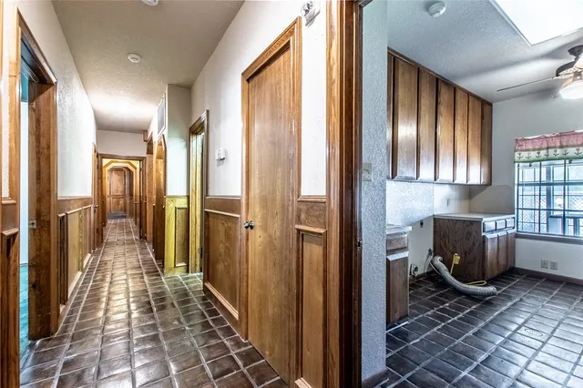 a bathroom with a glass door shower and bathroom