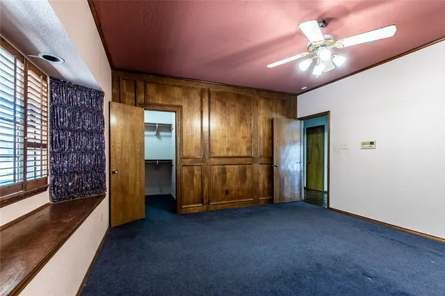 a view of an empty room with a fireplace