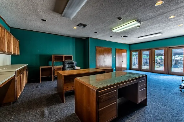 a room with furniture a flat screen tv and a large window