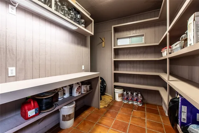 a picture of a room with shelves