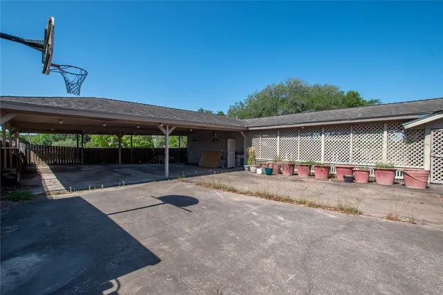 a view of large house with backyard and balcony
