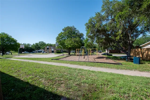 a view of a swimming pool with a patio