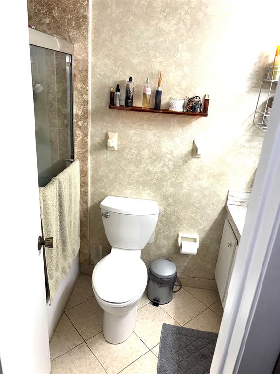 737 Southeast 1st Way, Unit 302 Deerfield Beach, FL 33441 - Photo 15 of 21 a bathroom with a toilet and a shower