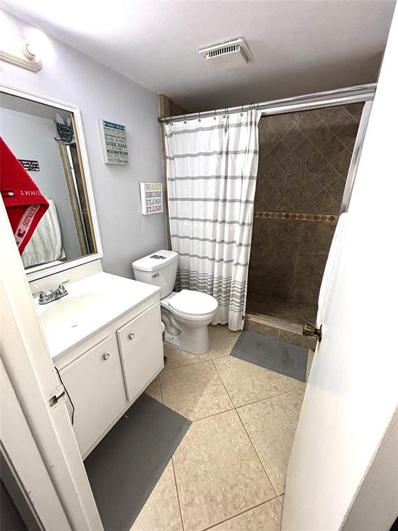 737 Southeast 1st Way, Unit 302 Deerfield Beach, FL 33441 - Photo 16 of 21 a bathroom with a sink toilet and shower