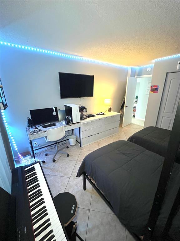 737 Southeast 1st Way, Unit 302 Deerfield Beach, FL 33441 - Photo 17 of 21 a living room with furniture and a flat screen tv