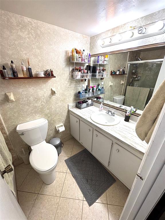 737 Southeast 1st Way, Unit 302 Deerfield Beach, FL 33441 - Photo 19 of 21 a bathroom with a toilet sink and mirror
