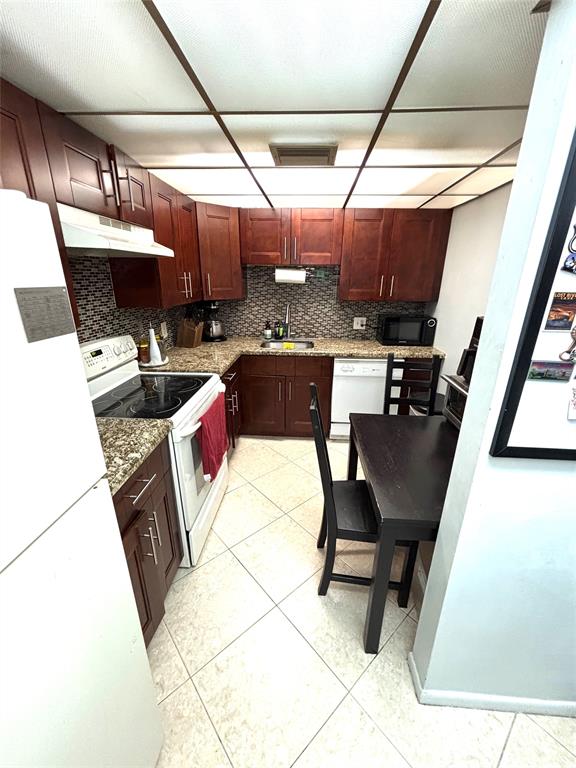 737 Southeast 1st Way, Unit 302 Deerfield Beach, FL 33441 - Photo 8 of 21 a living room with furniture and a flat screen tv