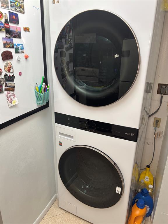737 Southeast 1st Way, Unit 302 Deerfield Beach, FL 33441 - Photo 9 of 21 a utility room with a washer and dryer