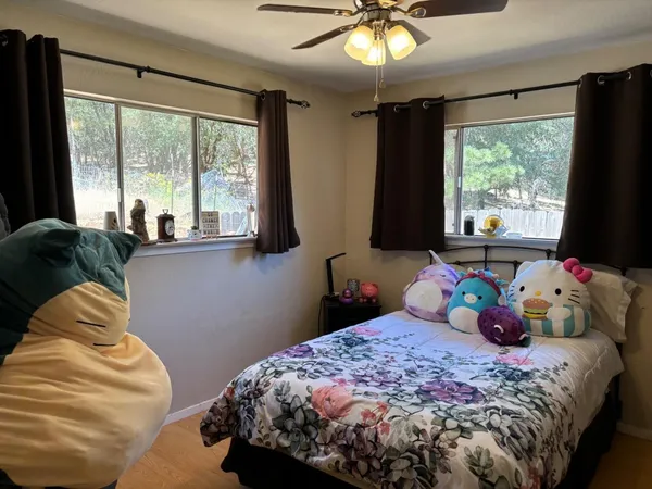 a bedroom with a bed and window