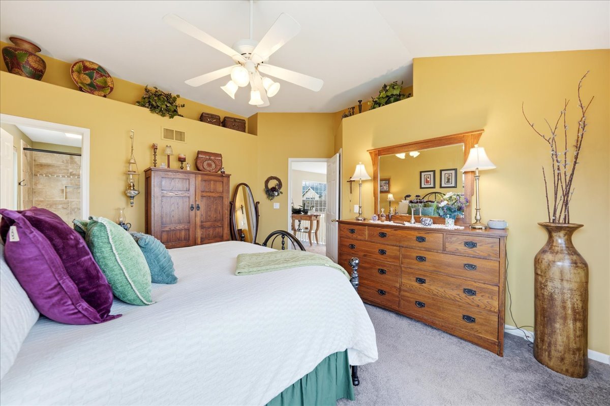334 Clearview Circle Round Lake, IL 60073 - Photo 15 of 36 a bed room with a bed and a mirror
