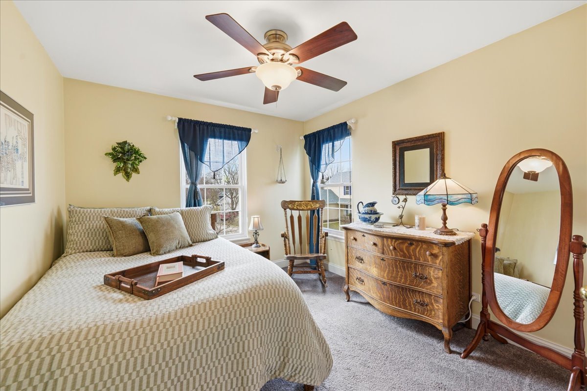 334 Clearview Circle Round Lake, IL 60073 - Photo 17 of 36 a bedroom with a bed a couch and dresser