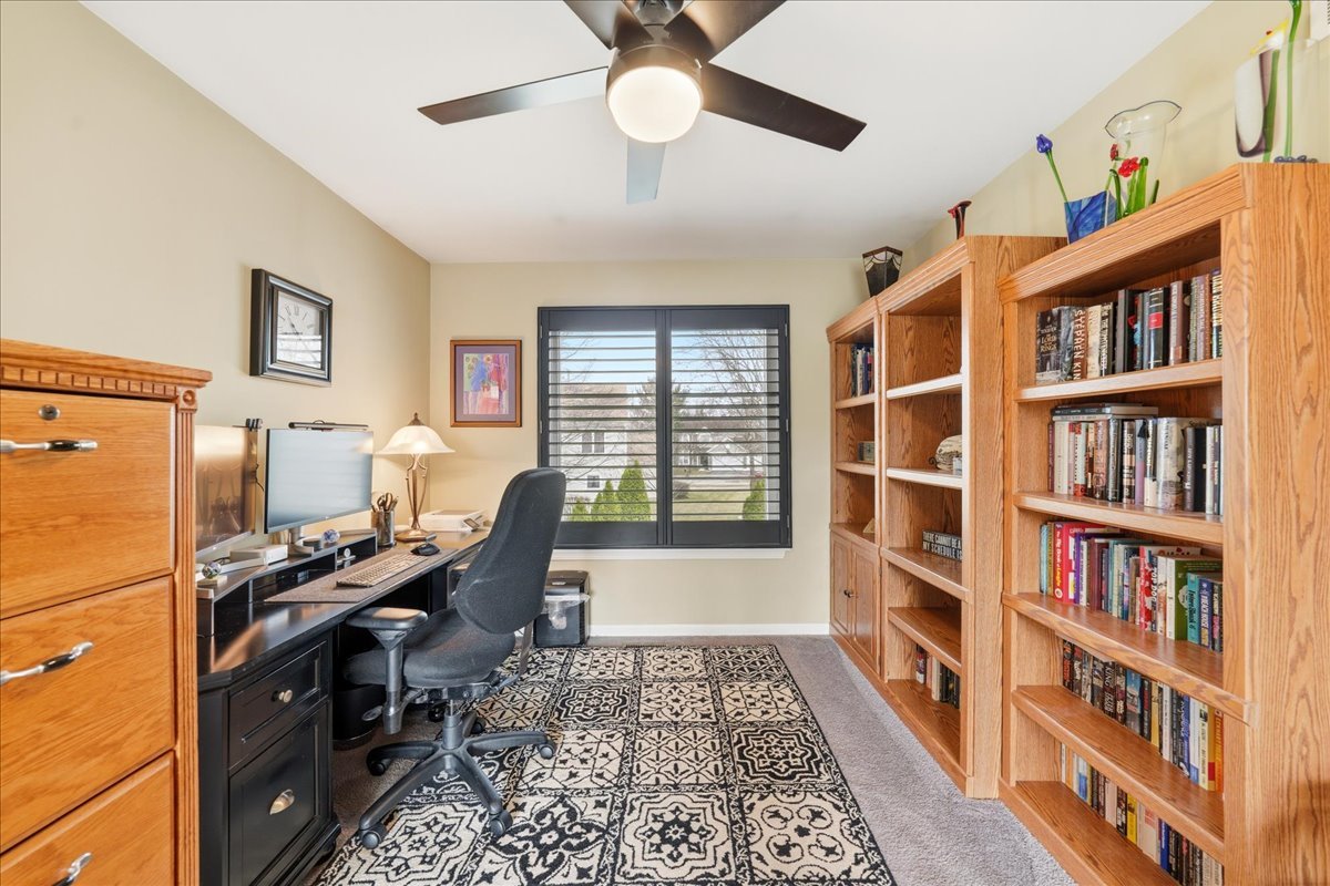 334 Clearview Circle Round Lake, IL 60073 - Photo 20 of 36 a view of a workspace with furniture and a bookshelf