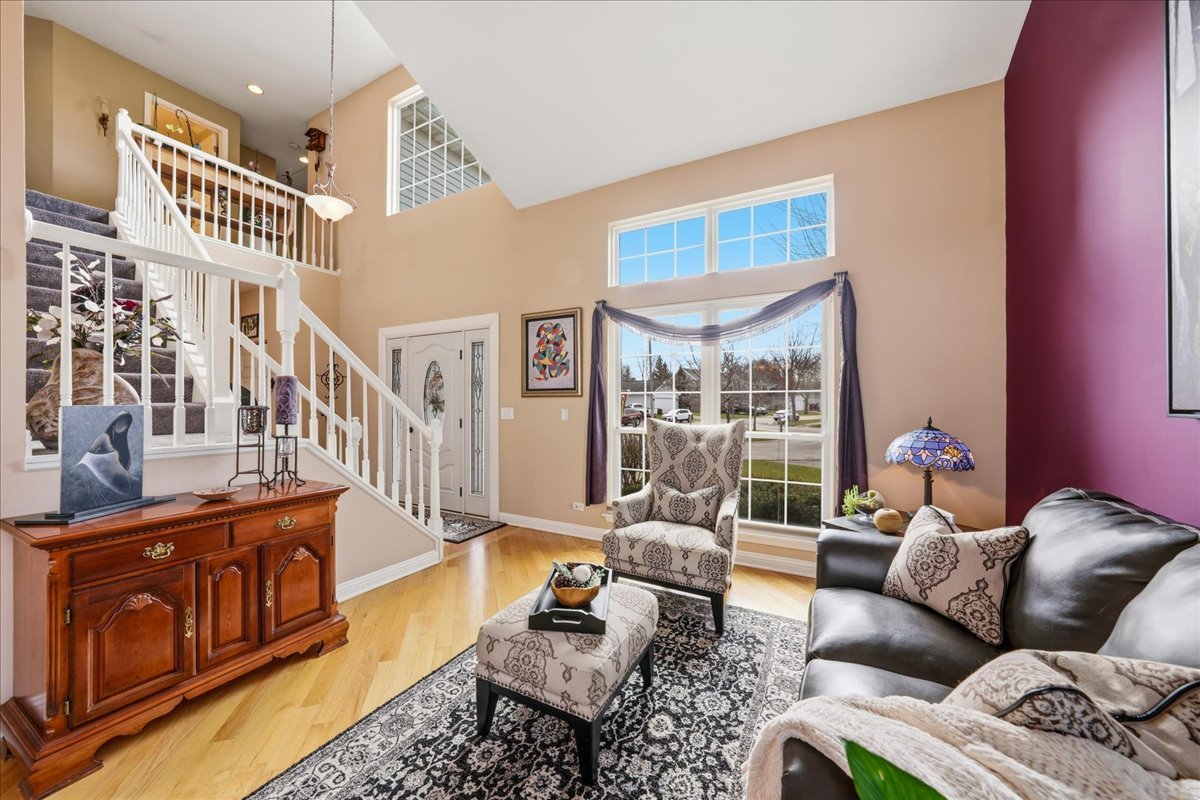 334 Clearview Circle Round Lake, IL 60073 - Photo 3 of 36 a living room with furniture wooden floor and a large window