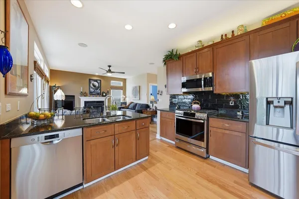 a kitchen with stainless steel appliances a stove sink and cabinets