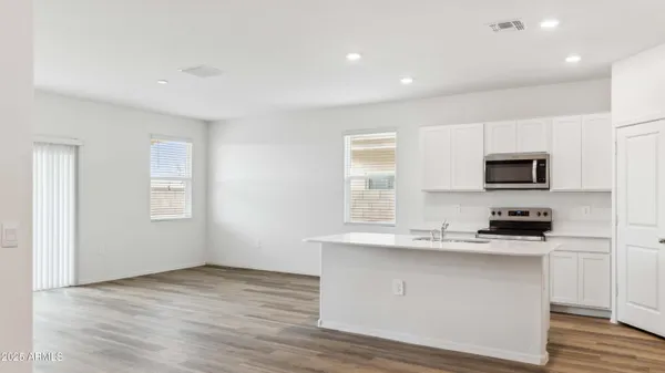 a kitchen with a sink and cabinets