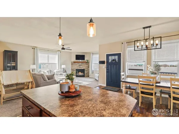 a kitchen with a refrigerator and microwave