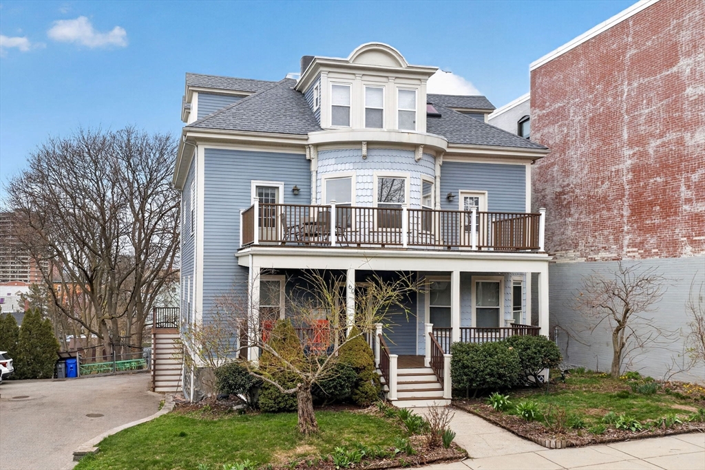 60 Iffley Road, Unit 2 Boston, MA 02130 - Photo 23 of 26 front view of a building with a yard