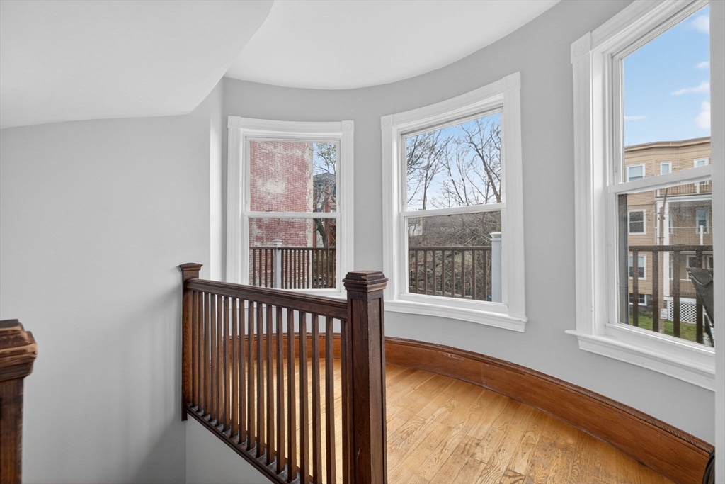 60 Iffley Road, Unit 2 Boston, MA 02130 - Photo 3 of 26 a view of a porch with wooden floor and a floor to ceiling window